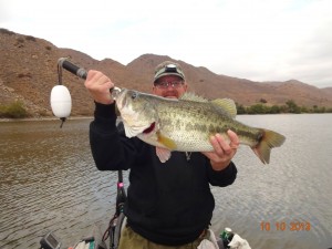 Randy Muirhead with 7 pound 10 ounce bass caught and released at corona lake