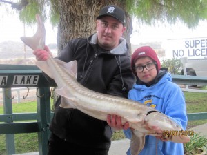 Seth Morley of Corona caught a 19 pound sturgeon - Corona Lake
