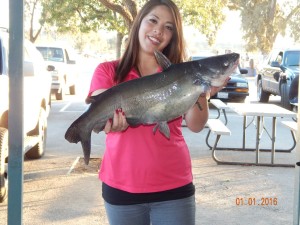 Lili Pendick of Costa Mesa caught a 13 pound catfish using a nightcrawler from a float tube