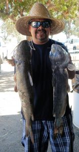 Jose Rivera with his 2 biggest cats