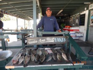 Santiago P with big tilapia at SARL